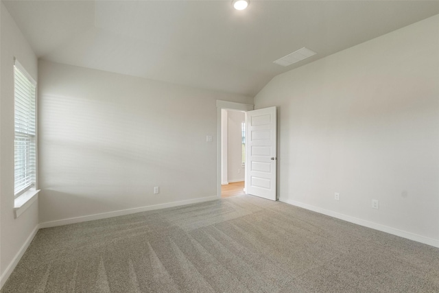 2971 Colonia Blossom Ln, Pinehurst, TX 77362 - carpeted spare room with vaulted ceiling and baseboards