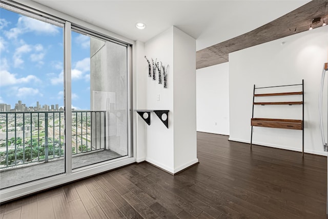 5925 Almeda Rd Unit 12403, Houston, TX 77004 - unfurnished room featuring a skyline view, dark wood finished floors, and recessed lighting