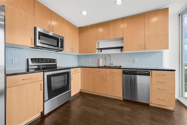 5925 Almeda Rd Unit 12403, Houston, TX 77004 - kitchen with appliances with stainless steel finishes, dark countertops, light brown cabinetry, dark wood finished floors, and recessed lighting