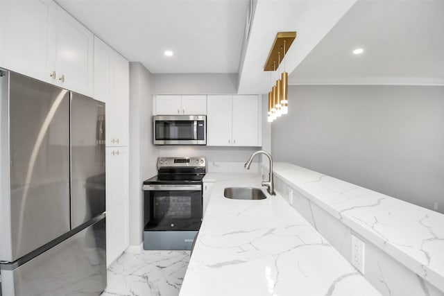 17202 Imperial Valley Dr Unit 3, Houston, TX 77060 - kitchen featuring appliances with stainless steel finishes, white cabinetry, light marble finish flooring, light stone countertops, and pendant lighting