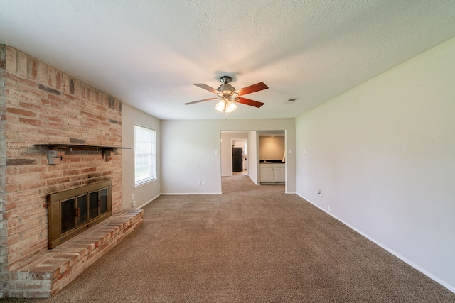 10006 Peachridge Dr, Houston, TX 77070 - unfurnished living room featuring carpet floors, a fireplace, a ceiling fan, and a textured ceiling