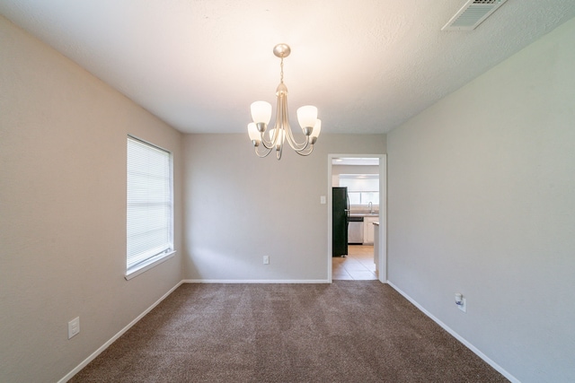 10006 Peachridge Dr, Houston, TX 77070 - unfurnished room featuring a chandelier and carpet floors