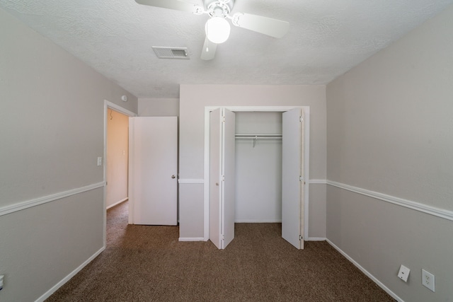 10006 Peachridge Dr, Houston, TX 77070 - unfurnished bedroom featuring carpet floors, a closet, ceiling fan, and a textured ceiling