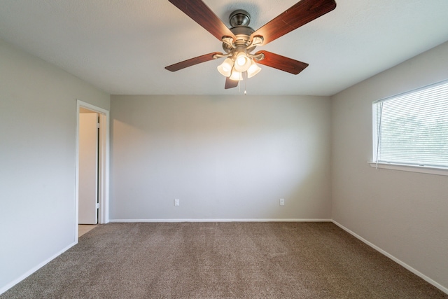 10006 Peachridge Dr, Houston, TX 77070 - carpeted empty room with a ceiling fan and baseboards