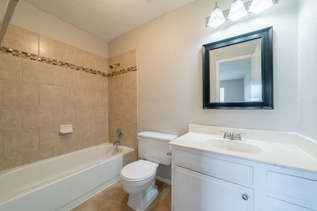 10006 Peachridge Dr, Houston, TX 77070 - bathroom featuring vanity, bathtub / shower combination, tile patterned flooring, and a textured ceiling