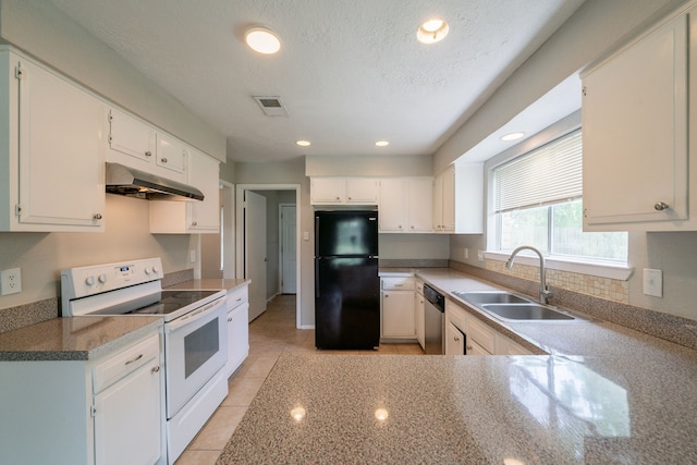 10006 Peachridge Dr, Houston, TX 77070 - kitchen with freestanding refrigerator, white range with electric cooktop, under cabinet range hood, dishwasher, and light tile patterned floors