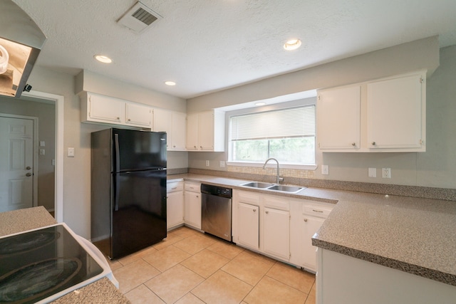 10006 Peachridge Dr, Houston, TX 77070 - kitchen with freestanding refrigerator, stainless steel dishwasher, white cabinetry, light tile patterned floors, and recessed lighting