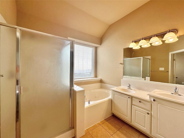 4315 Wellington Grove Ln, Katy, TX 77494 - bathroom featuring a stall shower, a whirlpool tub, double vanity, tile patterned floors, and vaulted ceiling