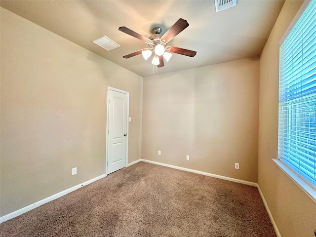4315 Wellington Grove Ln, Katy, TX 77494 - empty room featuring a ceiling fan, carpet flooring, and plenty of natural light