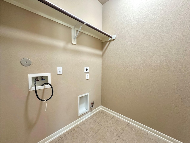 4315 Wellington Grove Ln, Katy, TX 77494 - laundry area with hookup for a gas dryer, washer hookup, electric dryer hookup, and light tile patterned floors