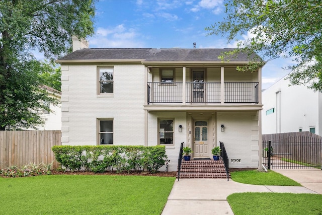 2037 Banks, Houston, TX 77098 - view of front of home featuring a balcony, a chimney, brick siding, a gate, and roof with shingles