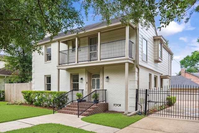 2037 Banks, Houston, TX 77098 - view of front of house with a balcony, brick siding, a gate, and concrete driveway