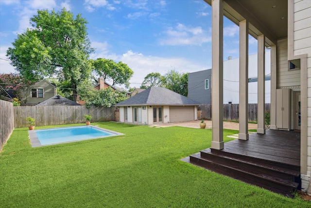 2037 Banks, Houston, TX 77098 - fenced backyard with an outdoor structure, a deck, a detached garage, and a patio