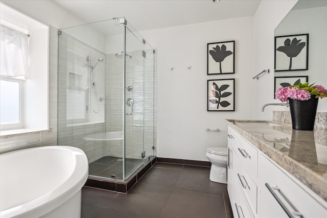 2037 Banks, Houston, TX 77098 - full bathroom featuring a freestanding tub, vanity, a stall shower, and tile patterned floors