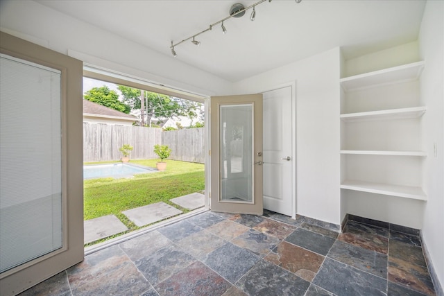 2037 Banks, Houston, TX 77098 - doorway with stone tile flooring and rail lighting