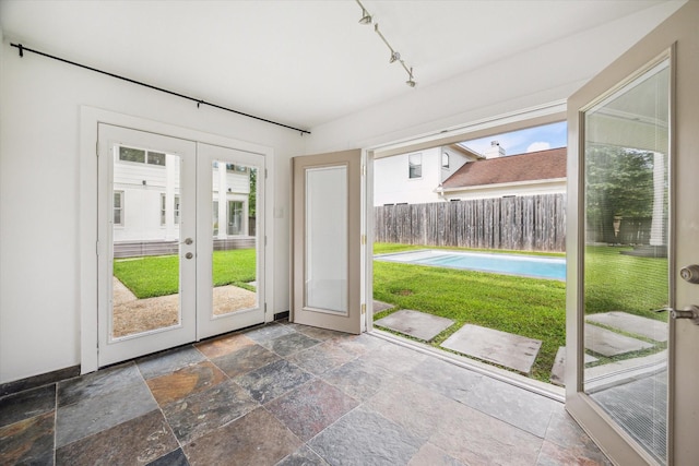 2037 Banks, Houston, TX 77098 - doorway to outside featuring french doors, stone tile flooring, and rail lighting