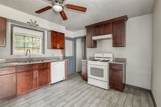 422 Gammon Dr, Houston, TX 77022 - kitchen featuring white appliances, under cabinet range hood, wood finish floors, a textured ceiling, and ceiling fan