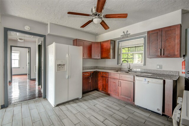 422 Gammon Dr, Houston, TX 77022 - kitchen featuring white appliances, a ceiling fan, a textured ceiling, wood finish floors, and light stone countertops