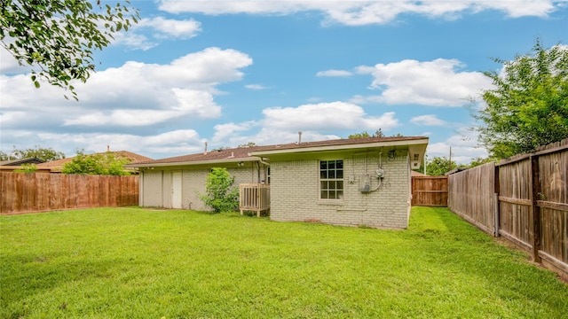 422 Gammon Dr, Houston, TX 77022 - rear view of property featuring brick siding and a fenced backyard