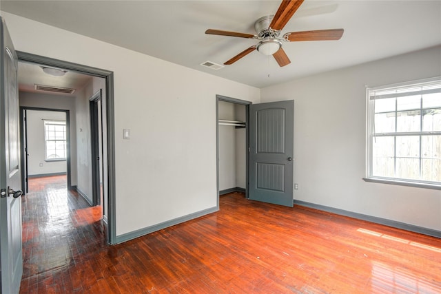 422 Gammon Dr, Houston, TX 77022 - unfurnished bedroom featuring dark wood-style flooring, a closet, and ceiling fan