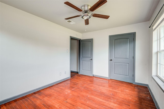 422 Gammon Dr, Houston, TX 77022 - unfurnished bedroom featuring wood finished floors and a ceiling fan