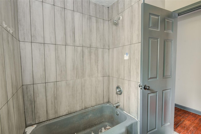 422 Gammon Dr, Houston, TX 77022 - bathroom featuring shower / tub combination and wood finished floors