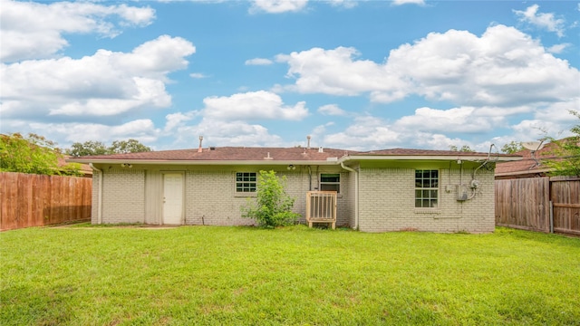 422 Gammon Dr, Houston, TX 77022 - back of property featuring brick siding and a fenced backyard