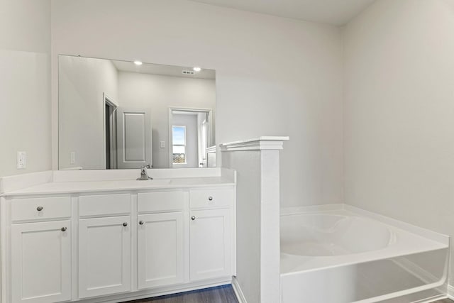 10811 Bright Beacon Dr, Beasley, TX 77417 - bathroom featuring a garden tub and vanity