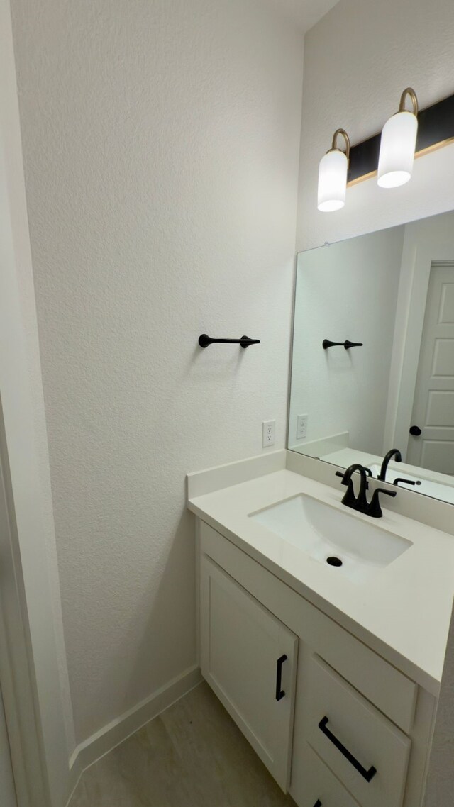 31422 Beacon Cove Trl, Fulshear, TX 77441 - bathroom with vanity and baseboards