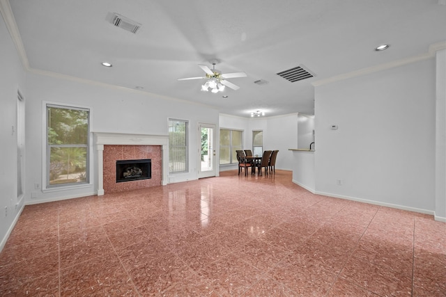 5110 Scottline Dr, Pasadena, TX 77505 - living area with crown molding, a fireplace, granite floors, ceiling fan, and recessed lighting