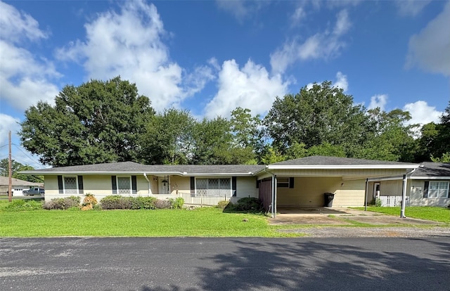 189 Hilldale Dr, Nederland, TX 77627 - ranch-style home with a front yard, a carport, and driveway