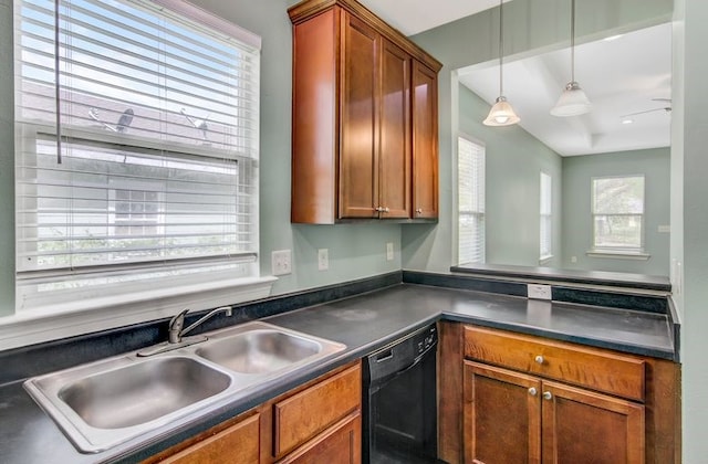2245 Wilson St, Beaumont, TX 77703 - kitchen with black dishwasher, dark countertops, healthy amount of natural light, and hanging light fixtures