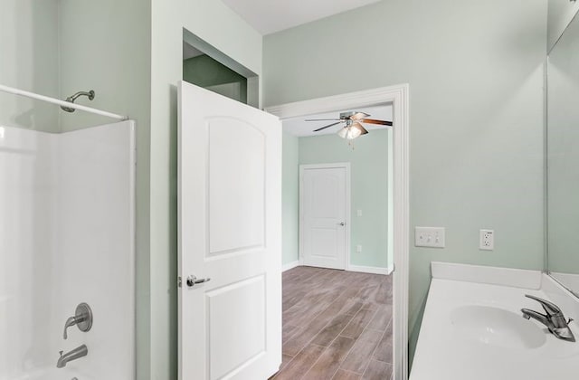 2245 Wilson St, Beaumont, TX 77703 - bathroom with ceiling fan, wood finished floors, vanity, and shower / bathtub combination