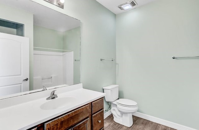 2245 Wilson St, Beaumont, TX 77703 - bathroom with wood finished floors, vanity, and a shower