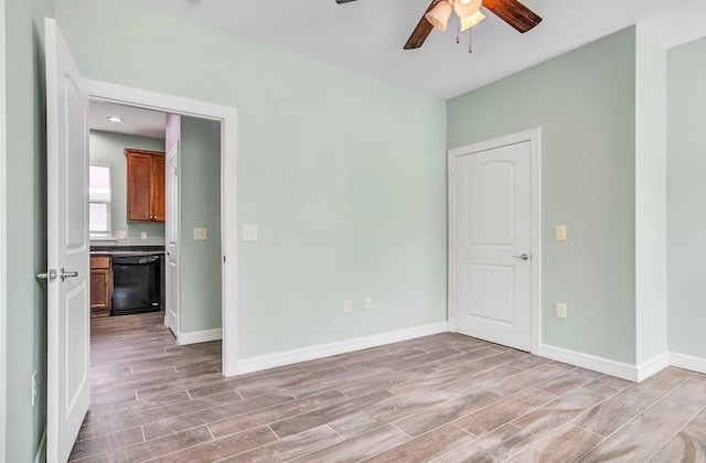 2245 Wilson St, Beaumont, TX 77703 - unfurnished room featuring wood tiled floors and a ceiling fan