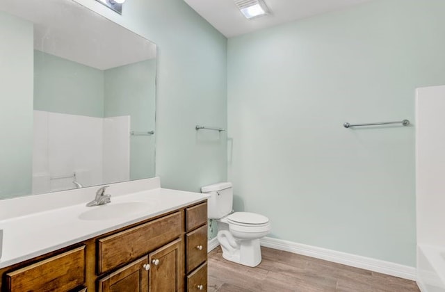 2245 Wilson St, Beaumont, TX 77703 - bathroom featuring wood finished floors, vanity, a tub, and a shower