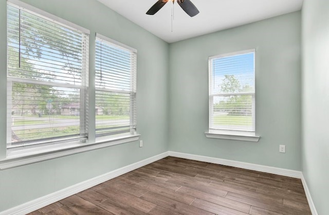 2245 Wilson St, Beaumont, TX 77703 - unfurnished room featuring plenty of natural light, ceiling fan, and dark wood-type flooring