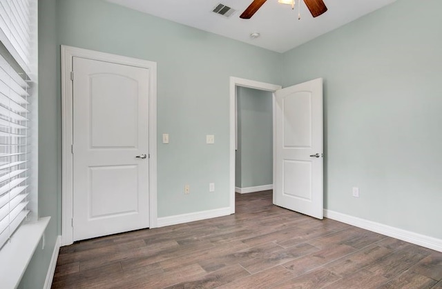2245 Wilson St, Beaumont, TX 77703 - unfurnished bedroom with wood finished floors and ceiling fan