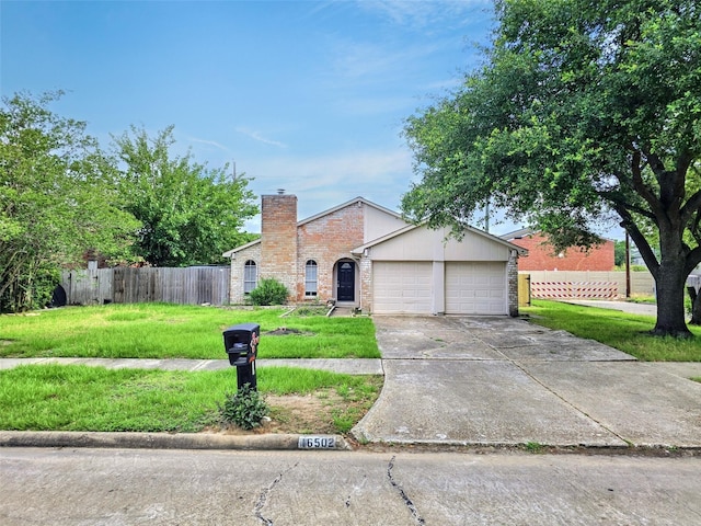 16502 Royal Mile Ln, Houston, TX 77084 - view of front of home with driveway, a chimney, an attached garage, and brick siding