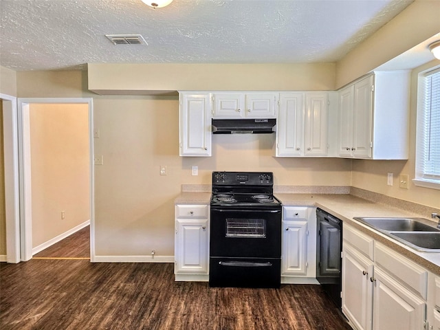 16502 Royal Mile Ln, Houston, TX 77084 - kitchen featuring black appliances, under cabinet range hood, white cabinets, dark wood-type flooring, and light countertops