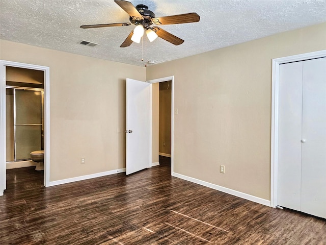 16502 Royal Mile Ln, Houston, TX 77084 - unfurnished bedroom with wood finished floors, a textured ceiling, connected bathroom, a closet, and a ceiling fan