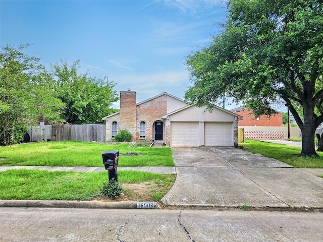 16502 Royal Mile Ln, Houston, TX 77084 - view of front of property with a garage, a chimney, driveway, and brick siding
