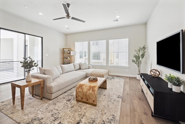 3057 Hicks St, Houston, TX 77007 - living room featuring light wood finished floors, ceiling fan, and recessed lighting