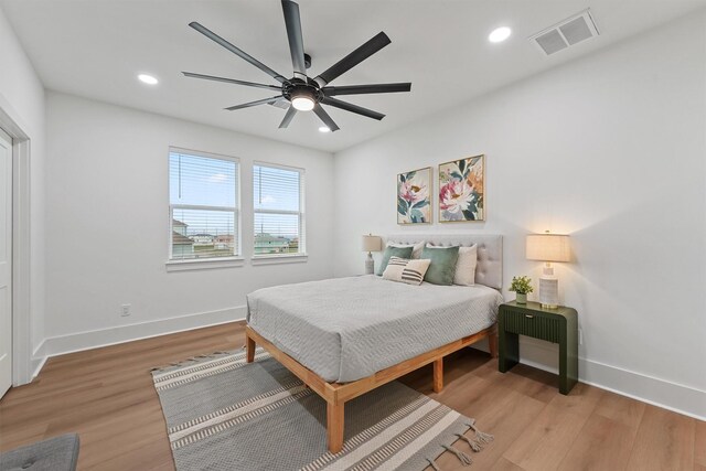 21330 Scissor Tail Ln, Galveston, TX 77554 - bedroom with light wood finished floors, recessed lighting, and a ceiling fan