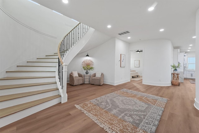 21330 Scissor Tail Ln, Galveston, TX 77554 - foyer entrance with wood finished floors, stairs, recessed lighting, and ceiling fan