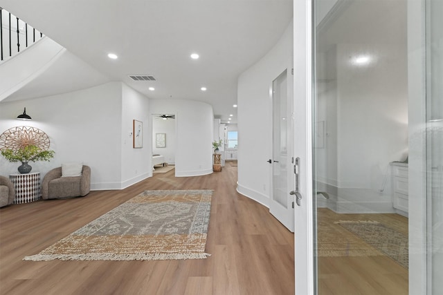 21330 Scissor Tail Ln, Galveston, TX 77554 - hall with wood finished floors, recessed lighting, and stairs