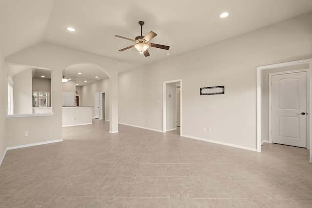 4211 Ponderosa Hills Ln, Katy, TX 77494 - unfurnished living room featuring ceiling fan, arched walkways, recessed lighting, light tile patterned flooring, and lofted ceiling