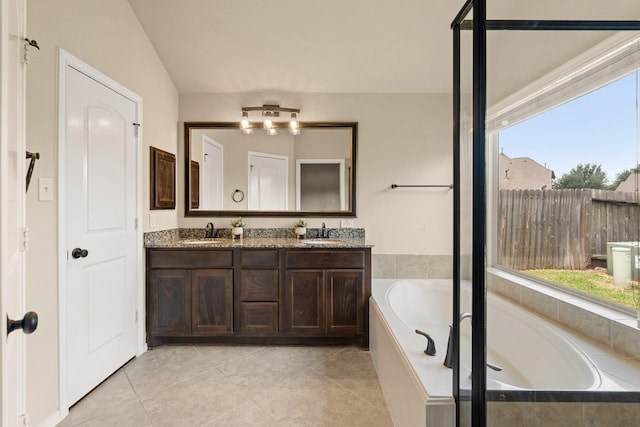 4211 Ponderosa Hills Ln, Katy, TX 77494 - bathroom featuring a garden tub, double vanity, and tile patterned floors