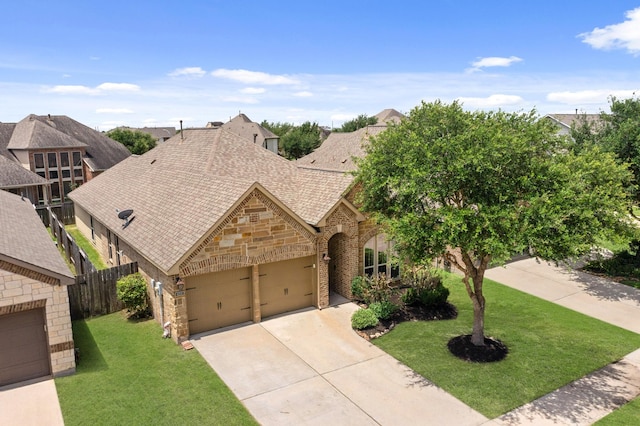 4211 Ponderosa Hills Ln, Katy, TX 77494 - view of front of house featuring stone siding, an attached garage, a shingled roof, driveway, and brick siding