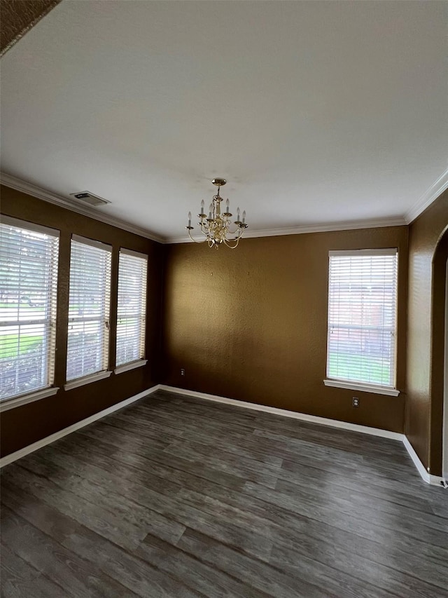 20019 Sterling Meadow Ct, Katy, TX 77449 - spare room with ornamental molding, a chandelier, dark wood finished floors, and arched walkways